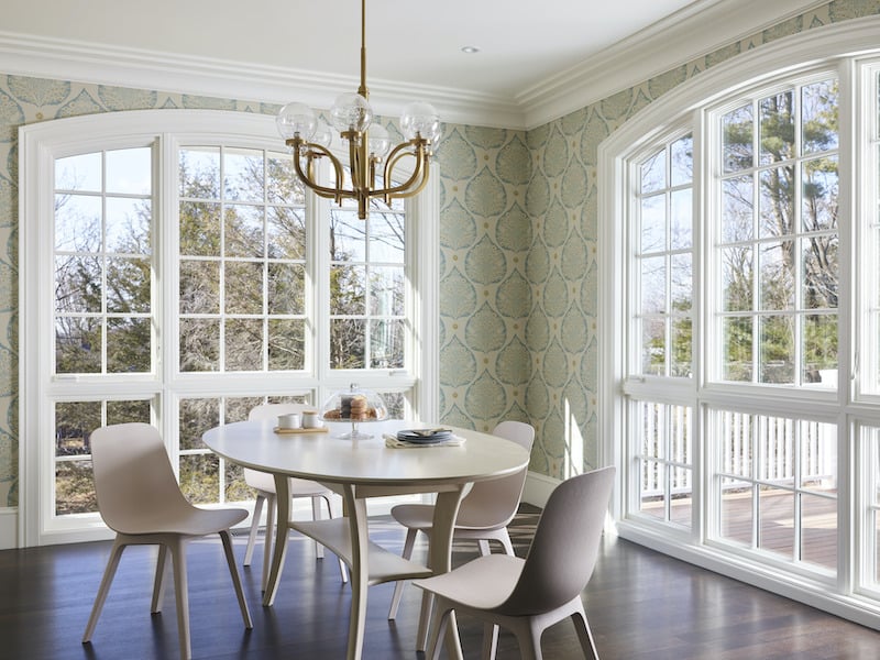 The dining room of the Cape Ann home, renovated by This Old House with Marvin windows and doors.