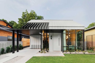Exterior photo of Stay Bungalow, a modern residential showroom in Austin, featuring Marvin Modern windows and doors. 