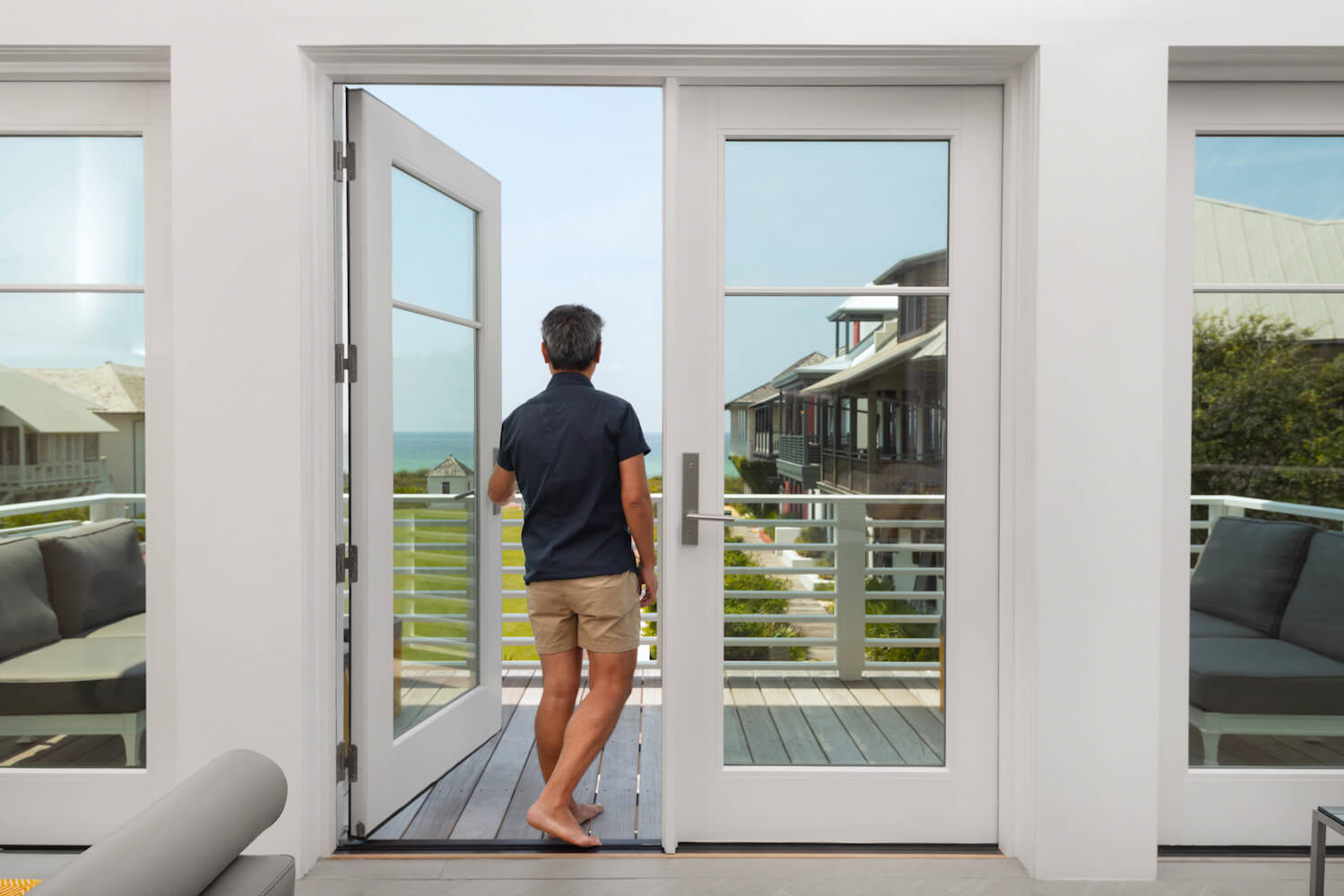 Vern Yip looking out of his beach home Marvin Door