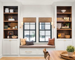 Two Marvin Elevate double hung windows in between two bookcases with a built in bench 