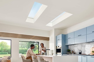 Two people in kitchen with Marvin Awaken Skylights and Marvin Skycove Window Box