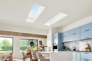 Family in kitchen with Marvin Skycove window box and Awaken Skylights