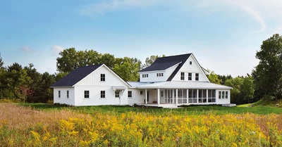 white farmhouse with Marvin windows