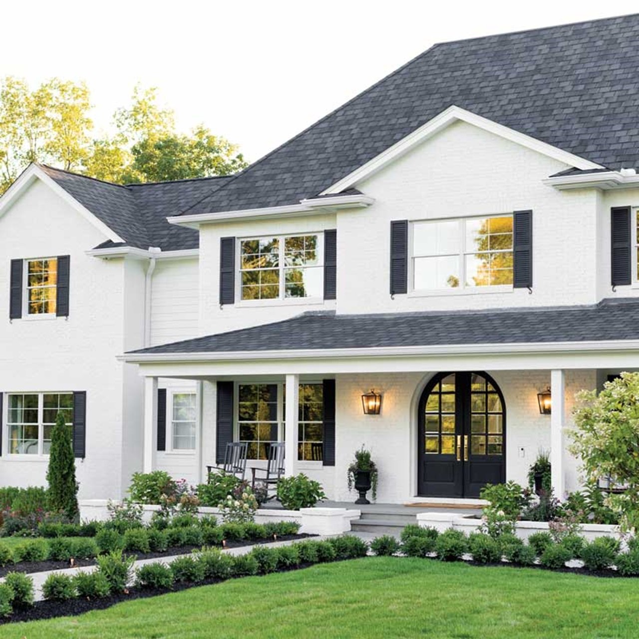 White home exterior with double hung windows and front porch