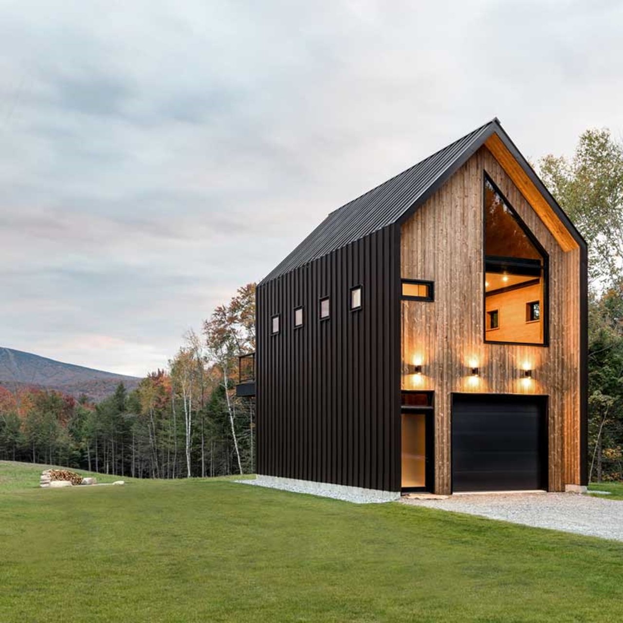 Modern cabin with a polygon window and wood exterior