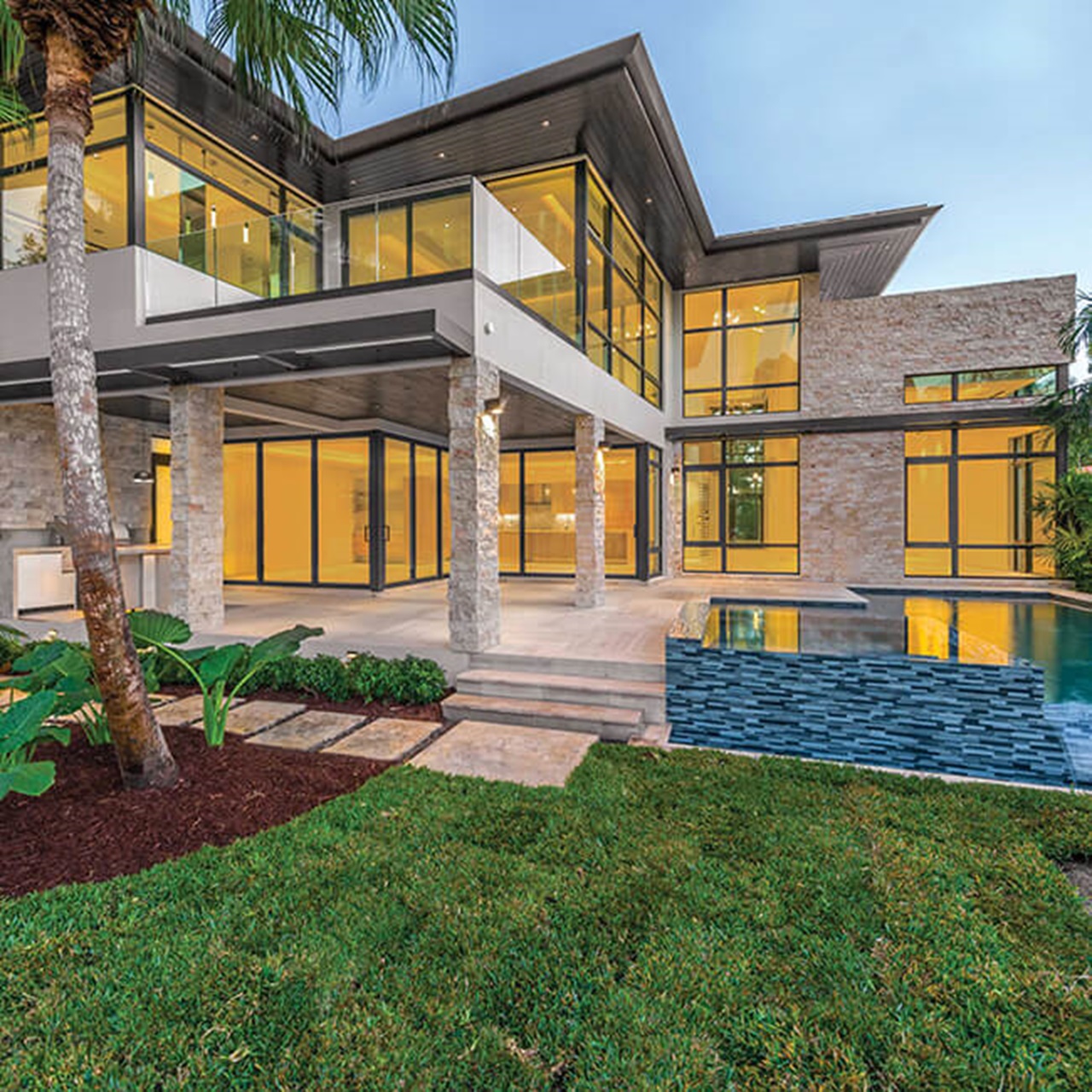 Exterior of home with Marvin Signature Coastline Casement Awning Picture Narrow Frame Windows and Multi-Slide Door