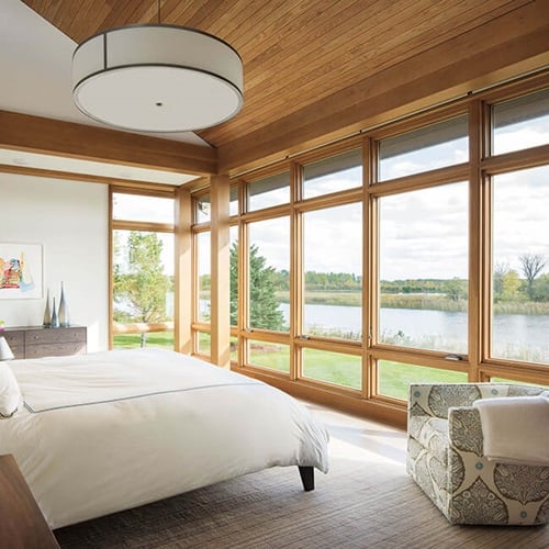Bedroom With View Of River Through Signature Ultimate Casement Windows