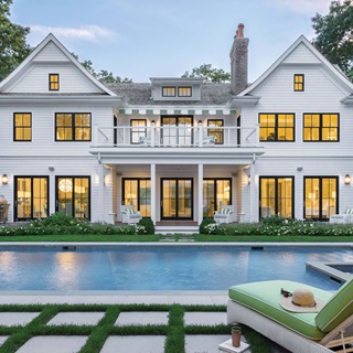Pool And Exterior View of Large White House With Signature Ultimate Double Hung G2 Windows 