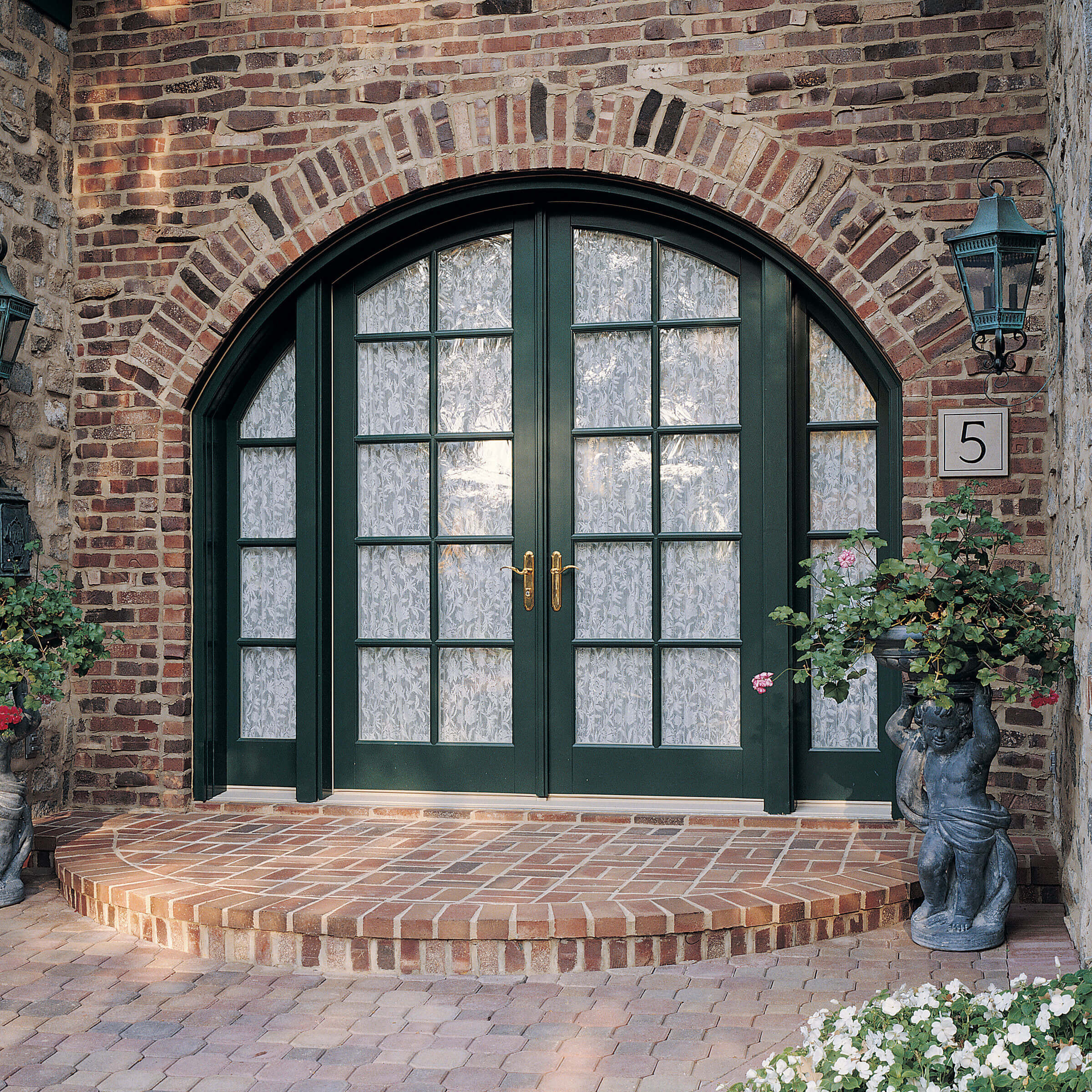 Beautiful Stone-Faced Entrance Of House With Signature Ultimate Swinging Arch Top French Door 