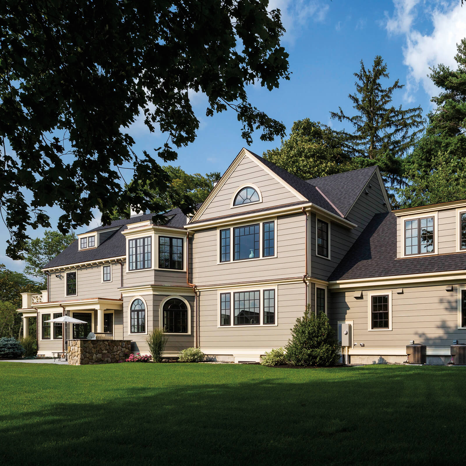 Traditional style home with Marvin Elevate Casement Windows, Double Hung Windows and Round Top Windows