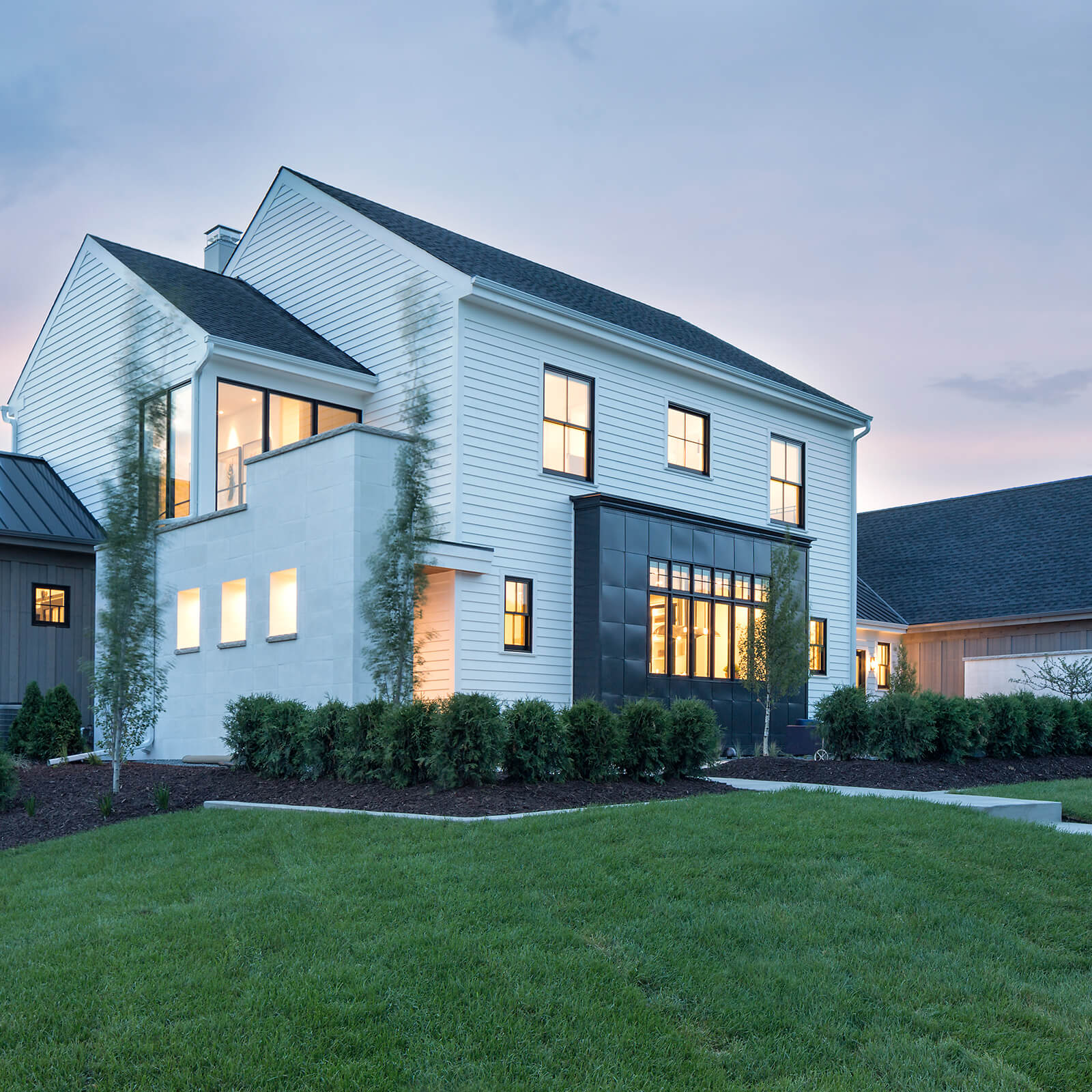 Exterior view of modern style home with Marvin Signature Ultimate Casement Windows and Ultimate Double Hung G2 Windows