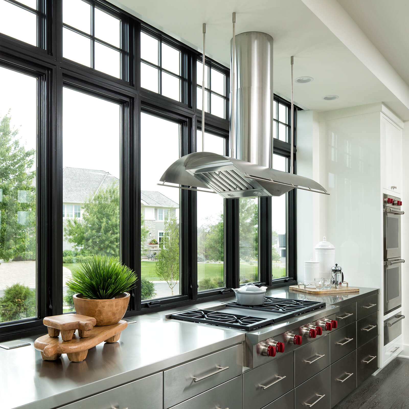 Large modern chef's kitchen with Marvin Signature Ultimate Double Hung G2 Windows and Ultimate Casement Windows