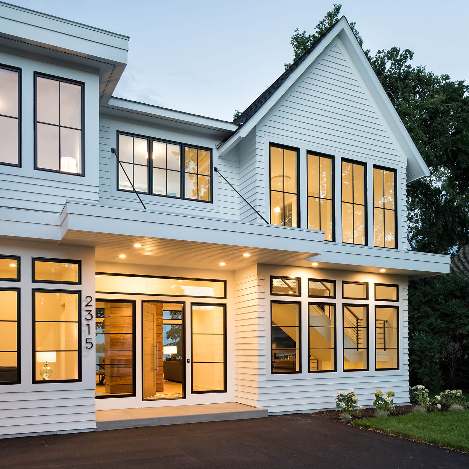Traditional style white exterior home with Marvin Elevate Casement Windows