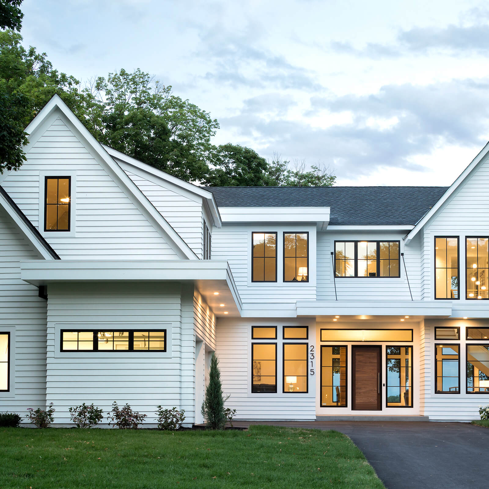 Traditional style white exterior home with Marvin Elevate Casement Windows and Elevate Picture Windows