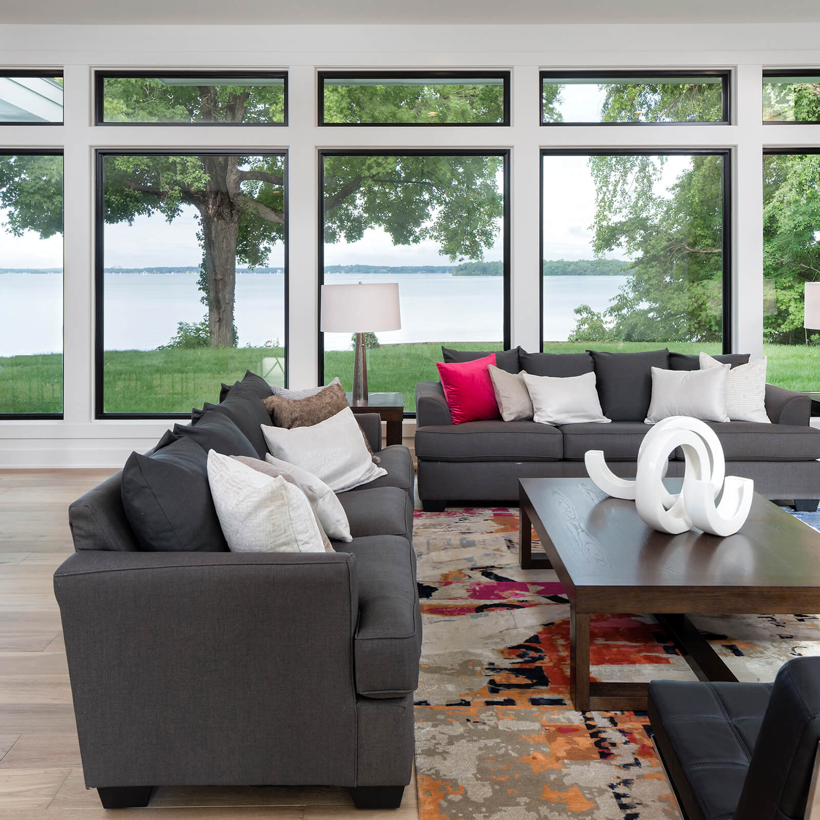 Lakefront home living room with Marvin Signature Ultimate Casement Windows and Ultimate Picture Windows