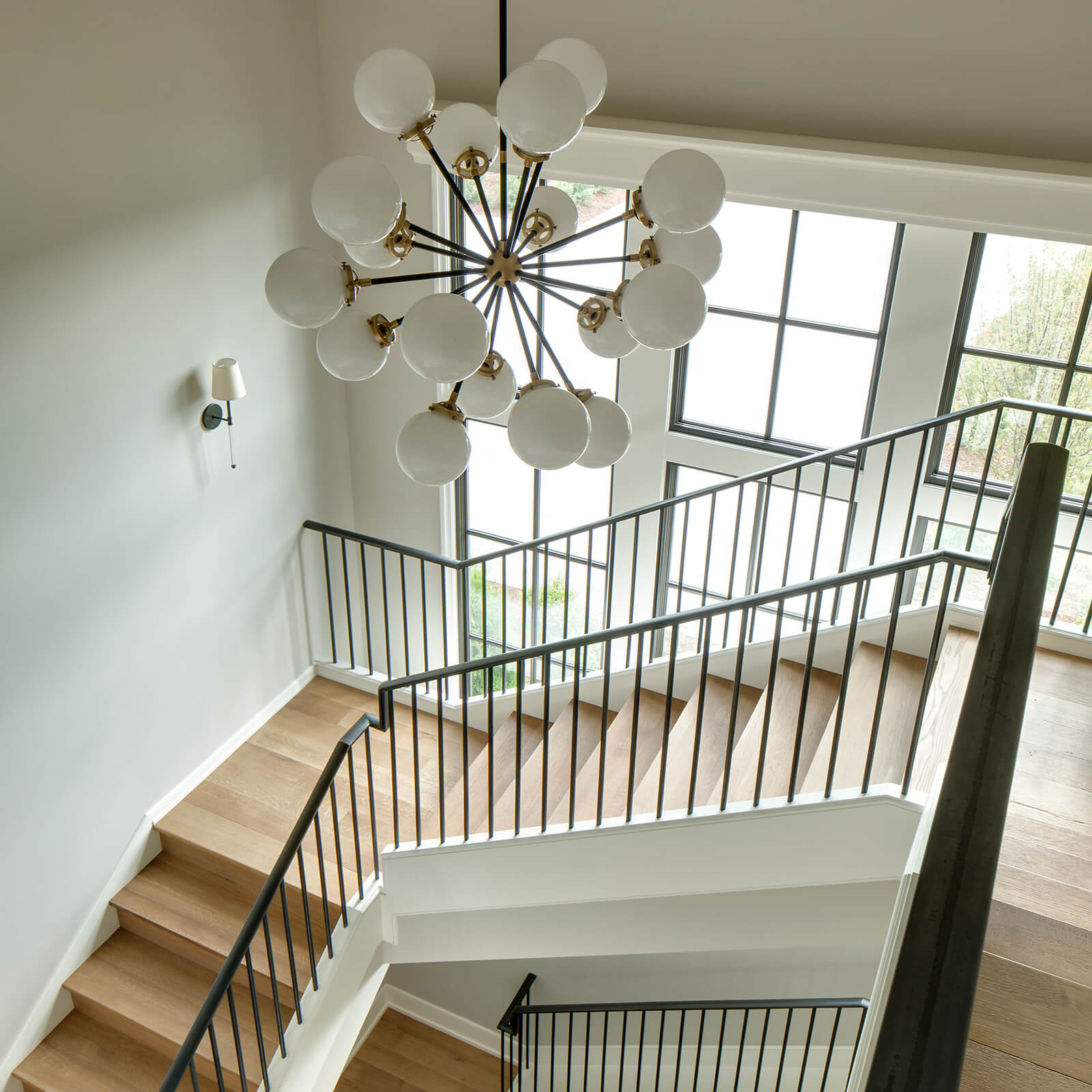 Interior stairwell view looking out to Marvin Signature Ultimate Casement Windows
