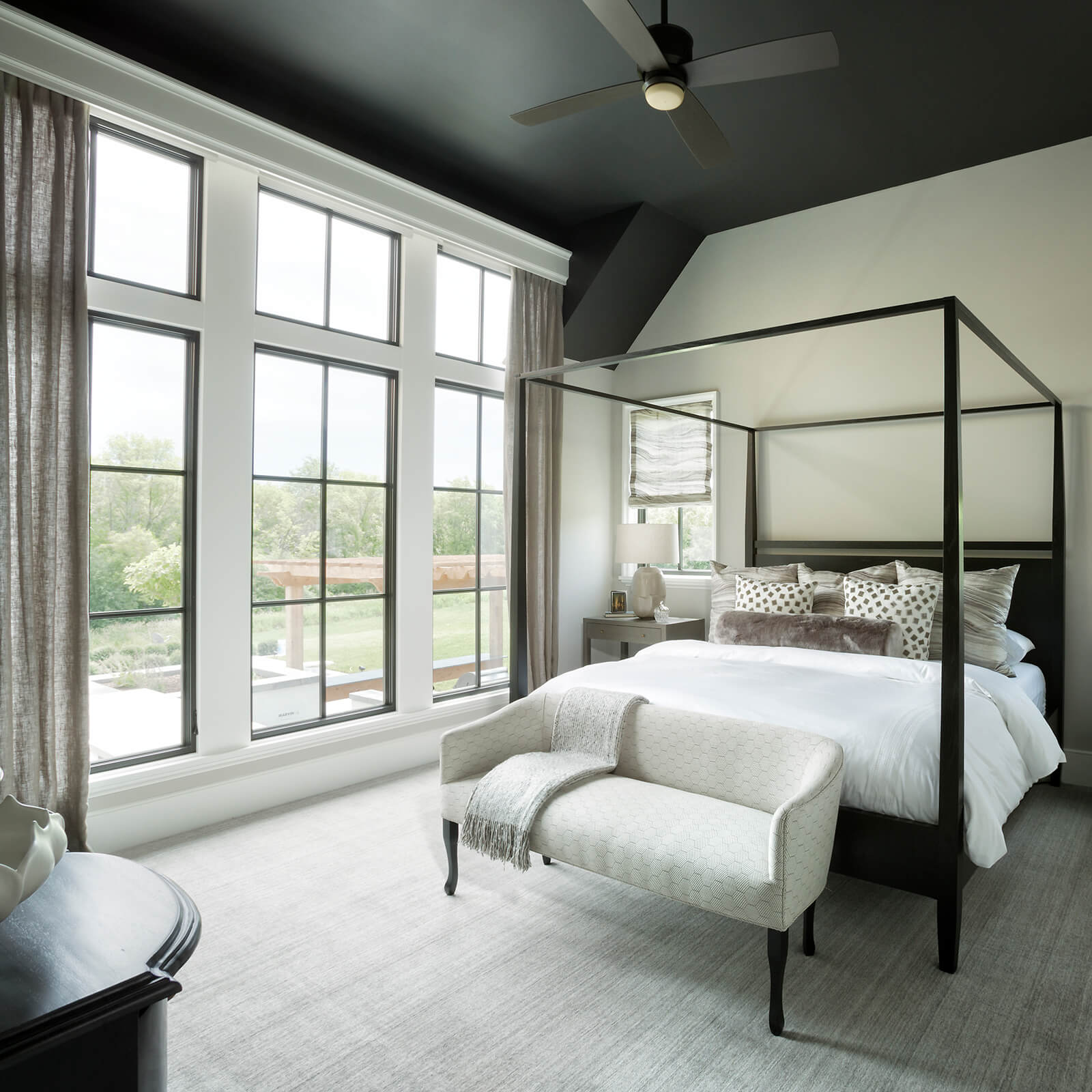 Large master bedroom with high ceilings and large Marvin Signature Ultimate Casement Windows