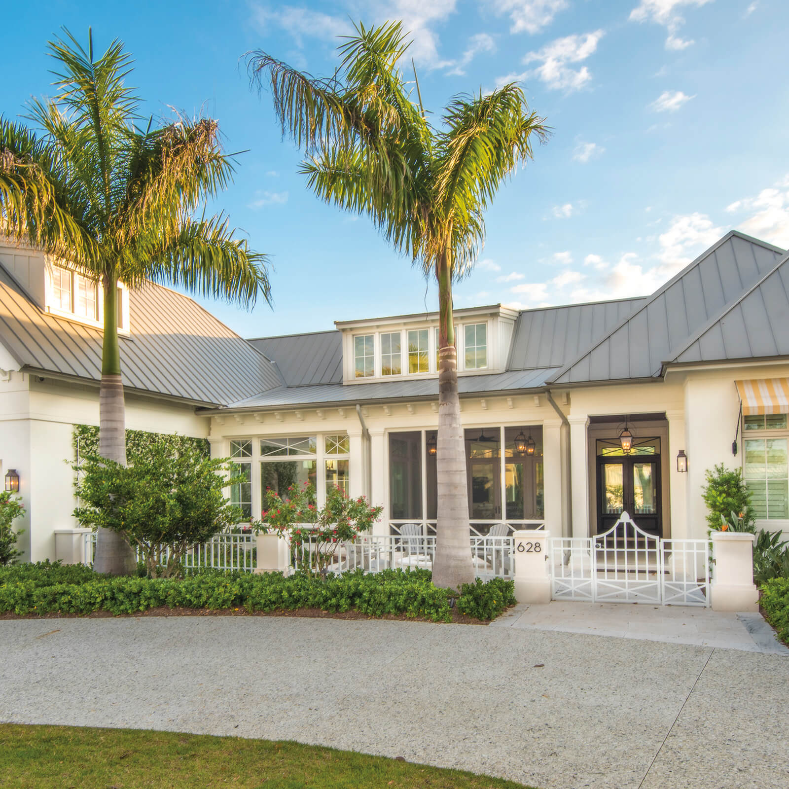 Traditional style beach home with Marvin Elevate Awning Windows and Elevate Outswing French Door