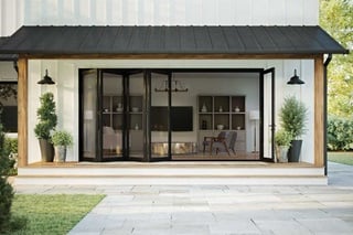 Exterior of home with partially open Elevate Bi-Fold Door