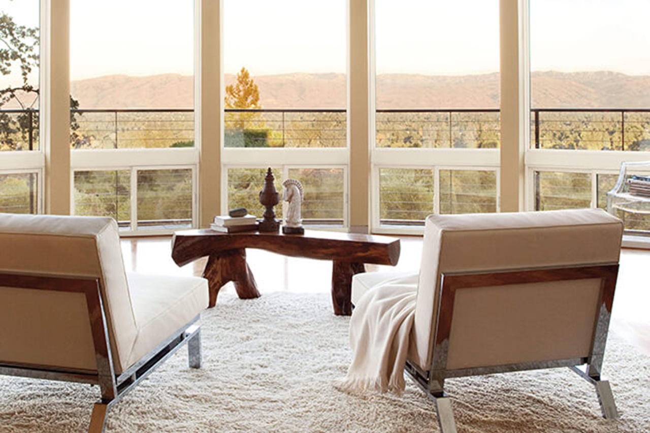 Two Chairs Facing Beautiful Outside View Through Marvin Essential Glider Windows