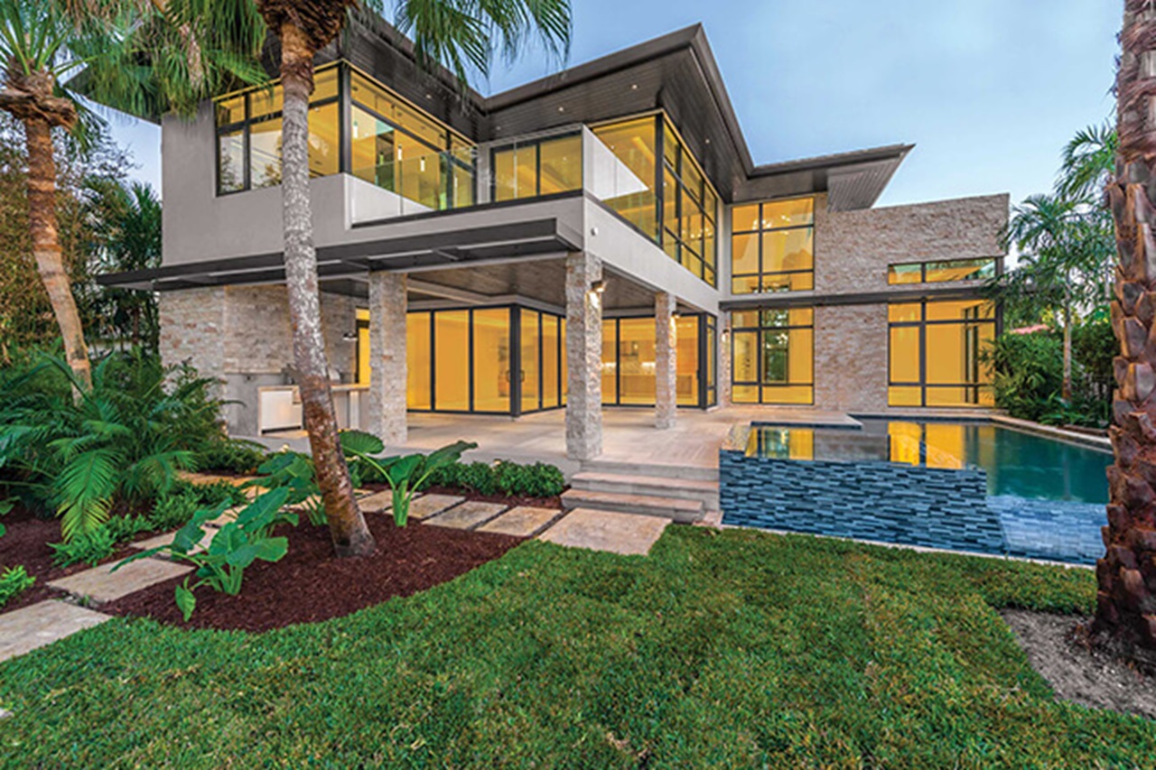 Exterior of home with Marvin Signature Coastline Casement Awning Direct Glaze Windows and Marvin Signature Coastline Multi-Slide Door