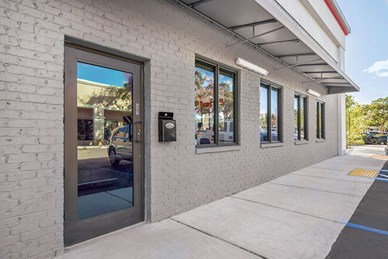Exterior of commercial building with Marvin Signature Coastline Outswing French Door