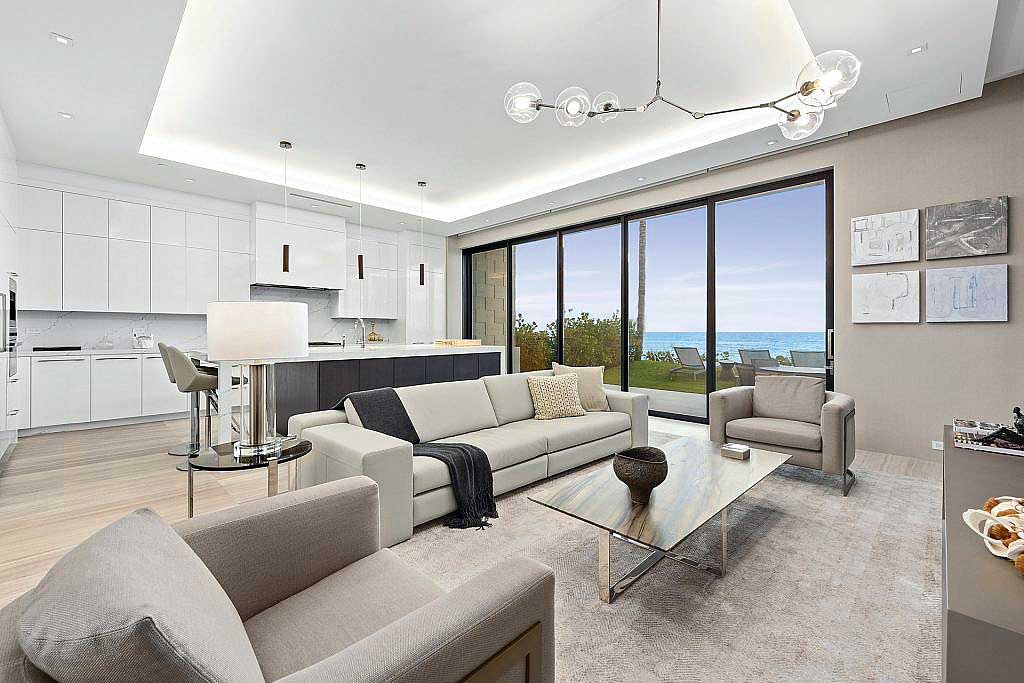 Open concept living room with Marvin Signature Coastline Multi-Slide Door
