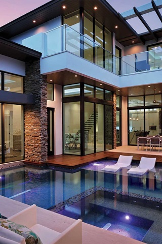 Modern style home with Marvin Signature Coastline Direct Glaze Window Pivot Door and Multi Slide Doors
