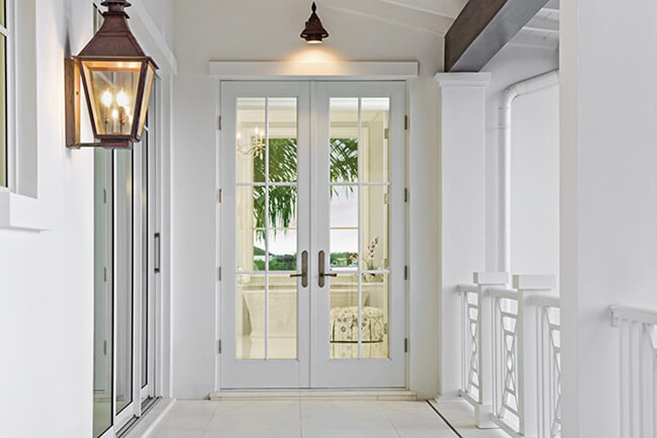 Interior hallway of home looking out a Marvin Signature Coastline Outswing French Door