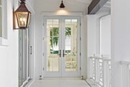Interior hallway of home looking out a Marvin Signature Coastline Outswing French Door