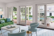 Green And Blue Living Room With Open Signature Ultimate Sliding French Doors