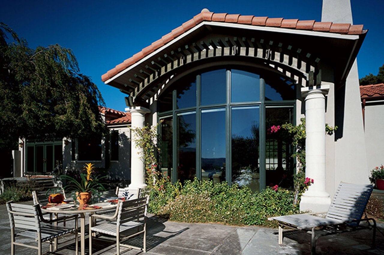 Patio And Exterior View Of House With Large Signature Ultimate Bay Windows
