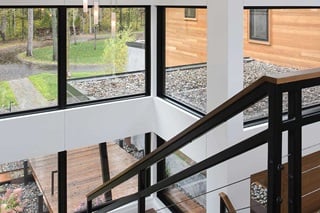 Large Stairwell Surrounded By Signature Ultimate Picture Narrow Frame Windows