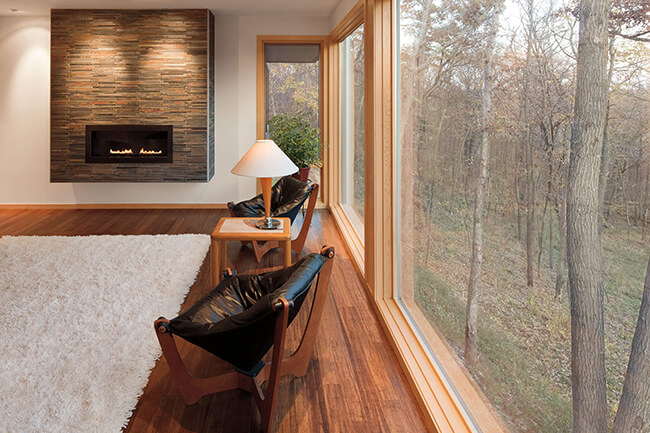 Living Room With View Of Trees Through Signature Ultimate Picture Window