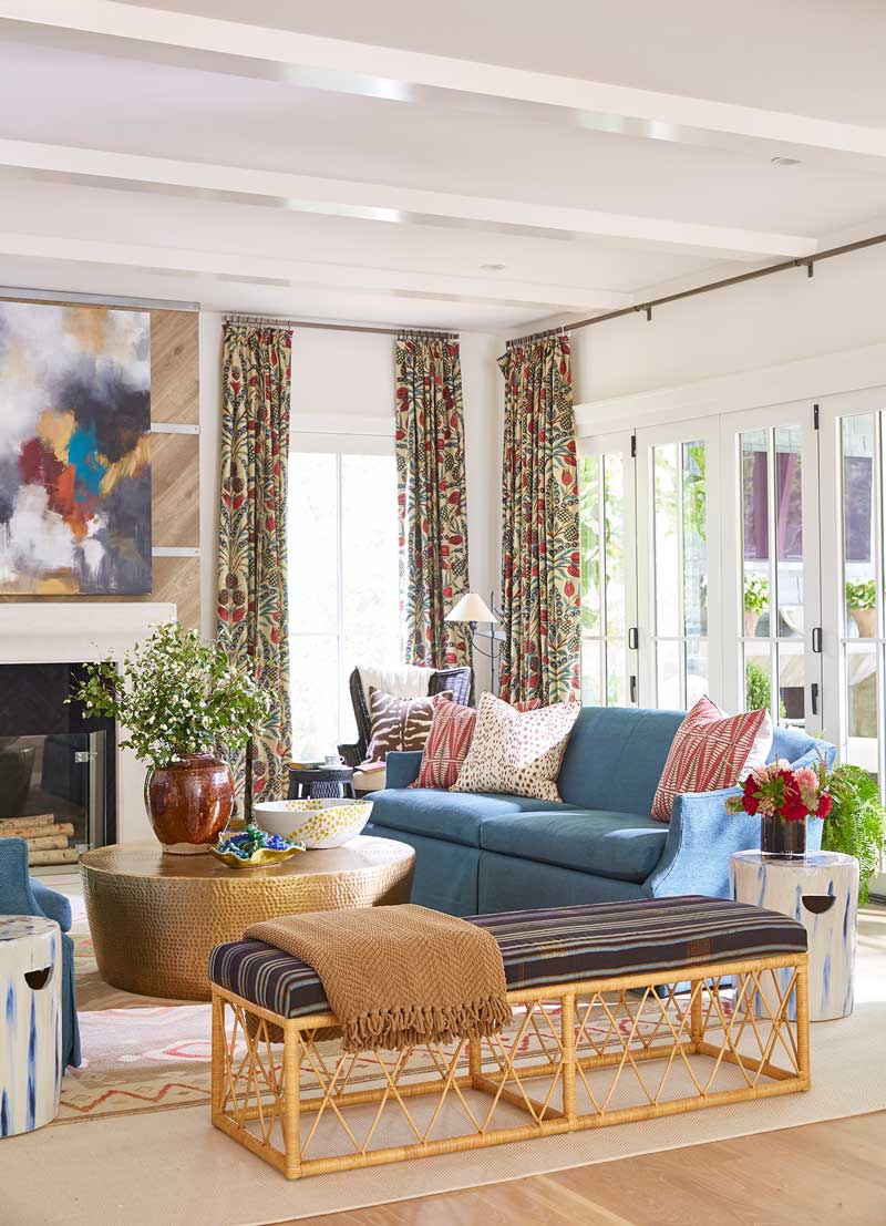 A contemporary living room in the House Beautiful Whole Home 2018 in Atlanta, Georgia, featuring a Marvin Ultimate Bi-Fold Door.