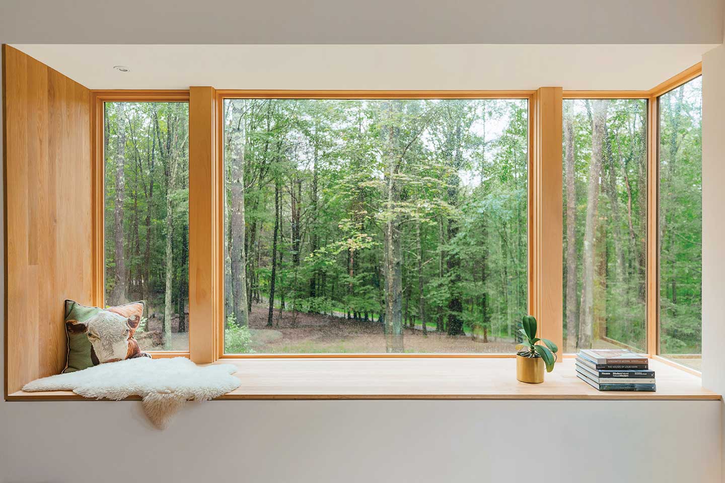  white oak window nook beneath a Marvin Ultimate Corner window featuring pine casings.