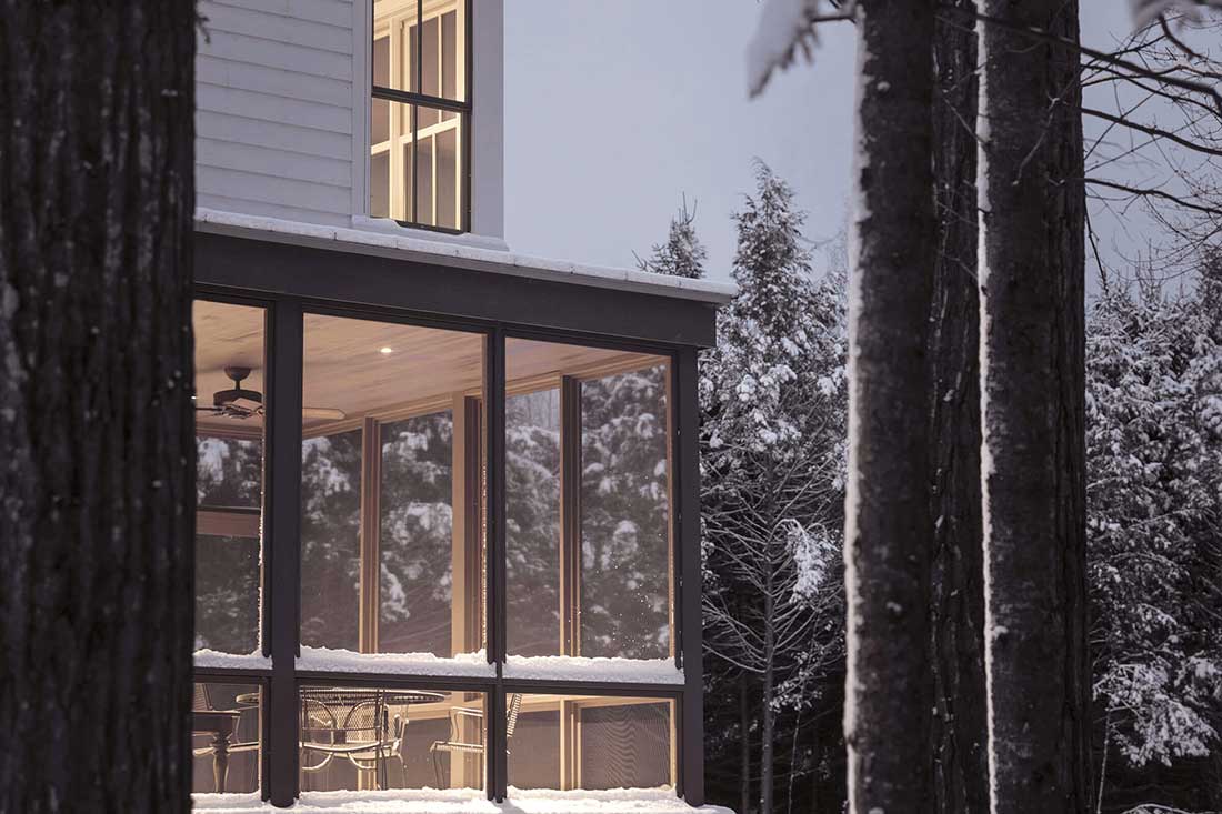Snowy Scene Of Home With Elevate Windows And Doors