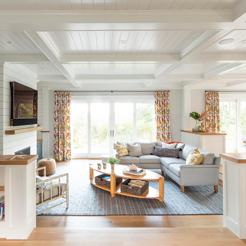 The family room in a Dutch Colonial home in Westerly, Rhode Island, featuring Marvin sliding doors.