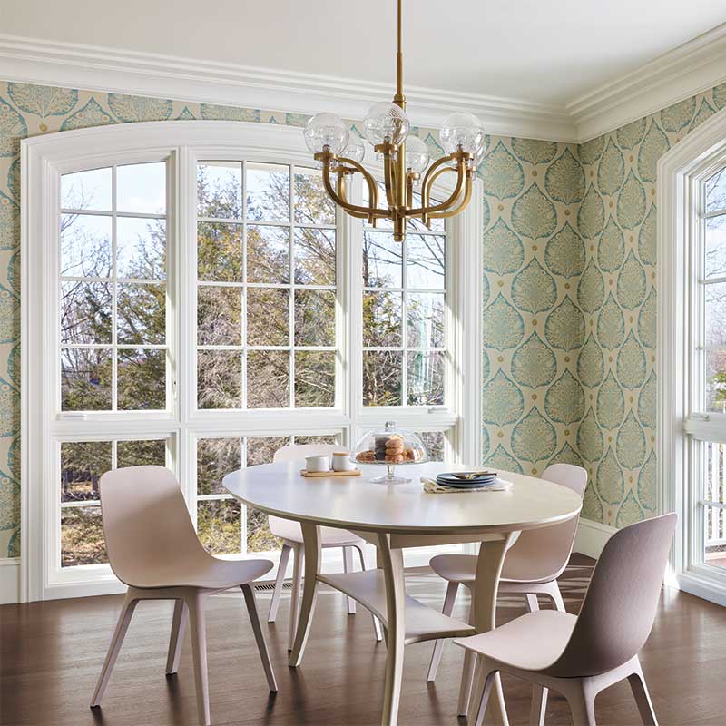 A dining area of an 1890s Cape Ann home featuring Marvin windows.