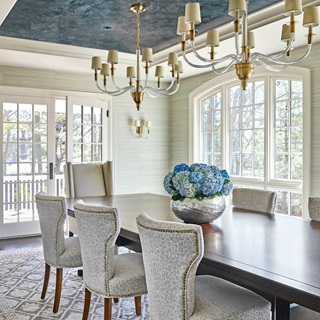 The formal dining room filled with light from Marvin windows and doors of the Cape Ann House, renovated by This Old House.