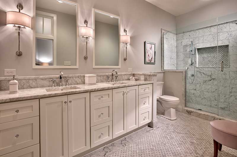 A contemporary bathroom in a historic school turned luxury condos, featuring Marvin Elevate double hung windows.