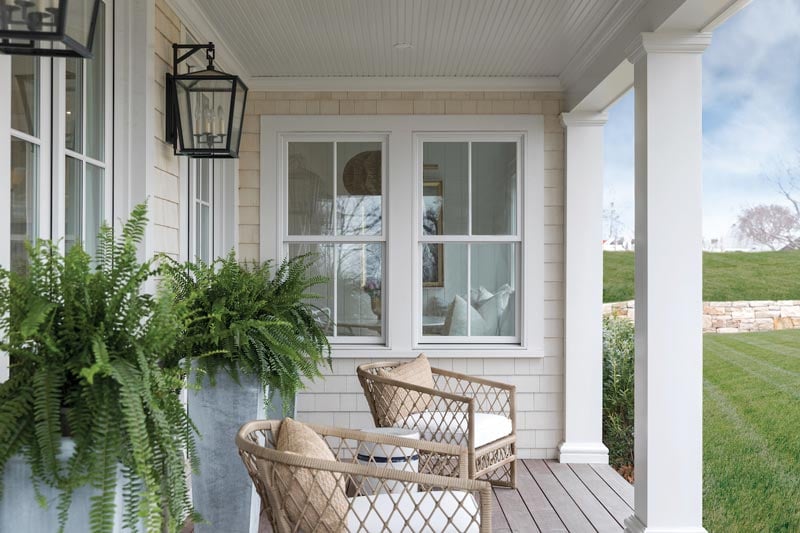 A traditional porch with Marvin Elevate casement windows