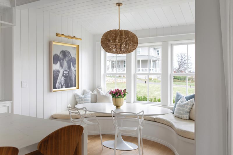 A large, bright breakfast nook with Marvin Elevate double hung windows.