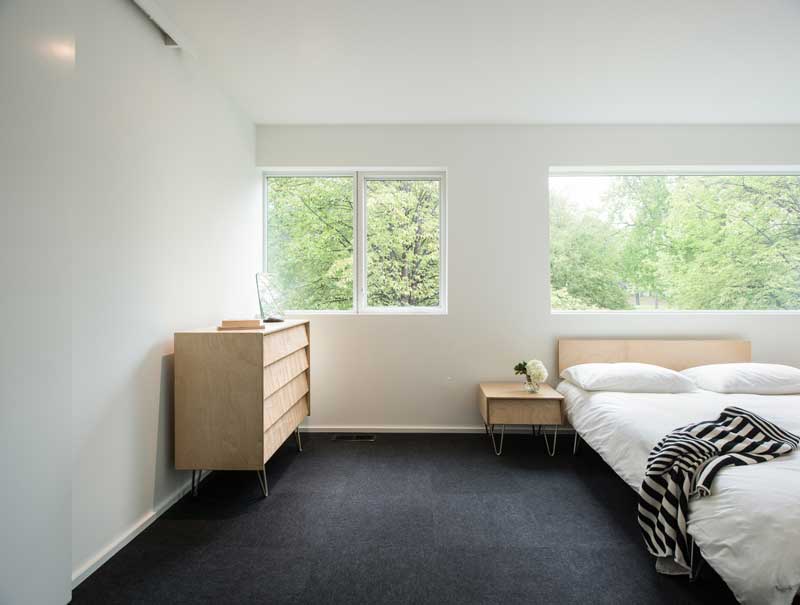 Nordic-inspired bedroom, featuring Marvin Essential Picture and Casement windows. 