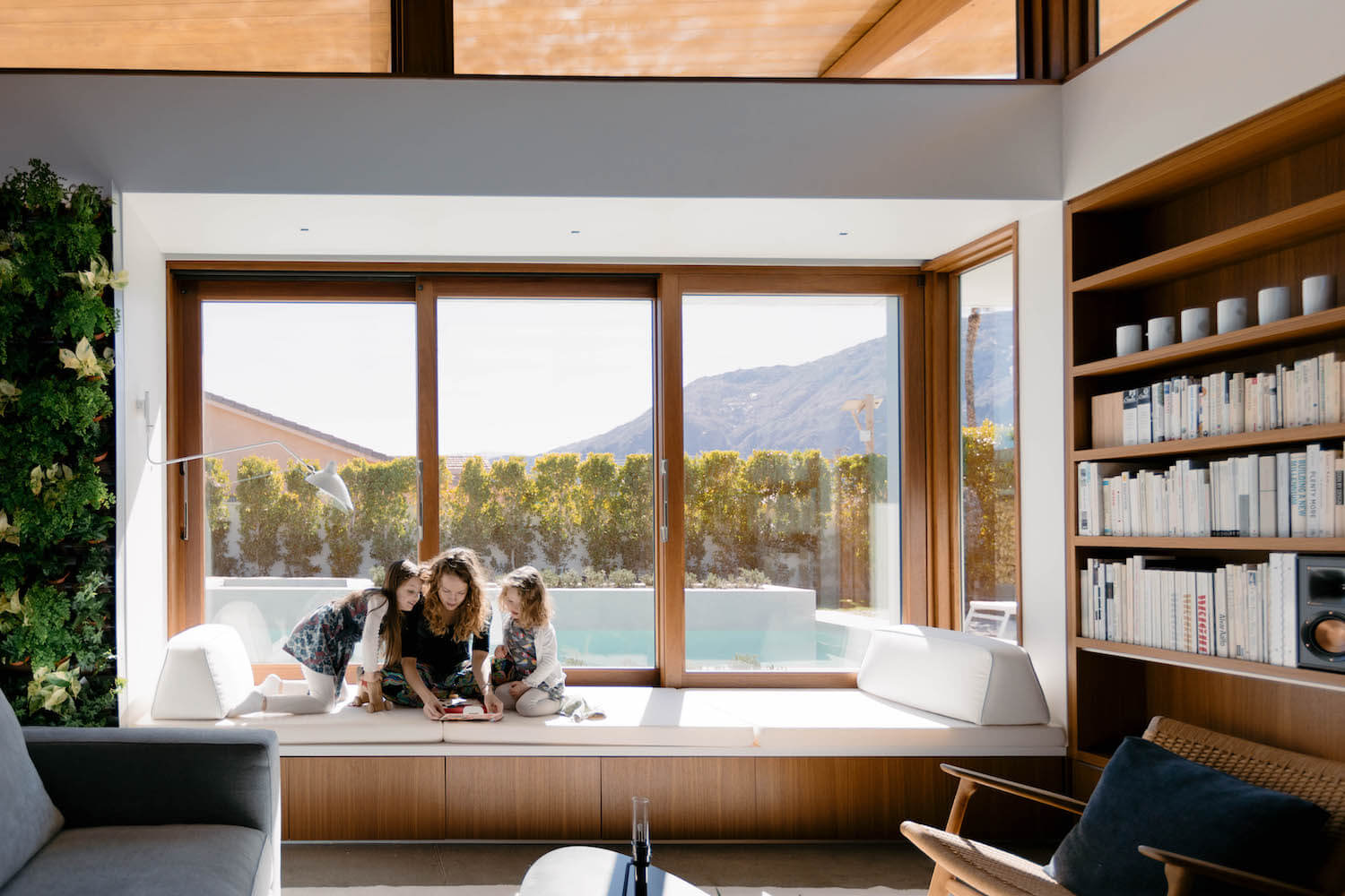 Meelena Turkel and her daughters on the window seat in Axiom Desert House.