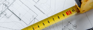 Tape measure on top of blueprint