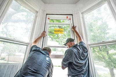 Two men installing Marvin Replacement Windows