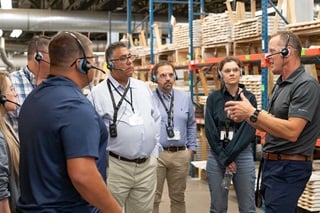 Warroad employee providing a tour of the warehouse facility